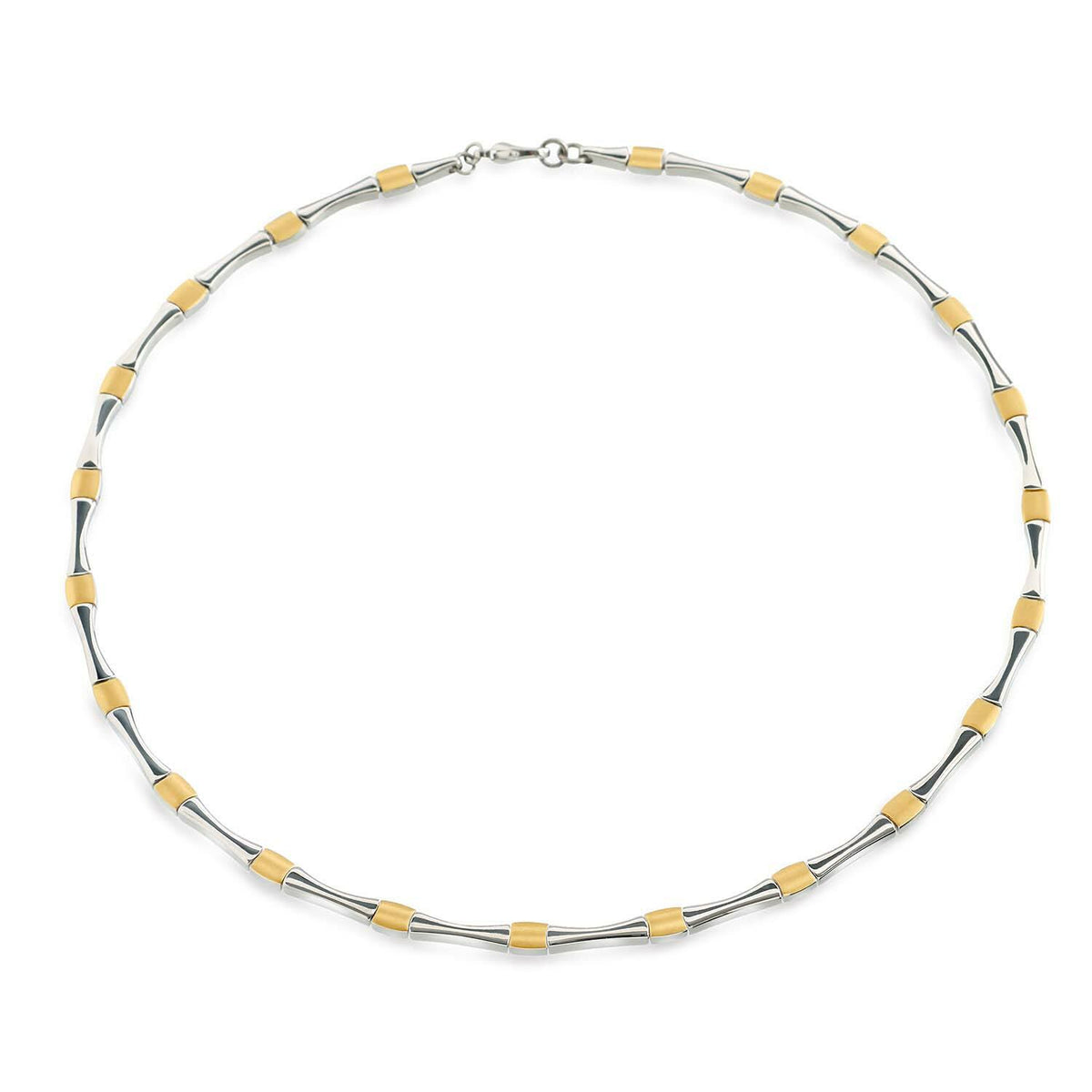 Collier bicolore en titane avec des éléments argentés et dorés, forme ronde.