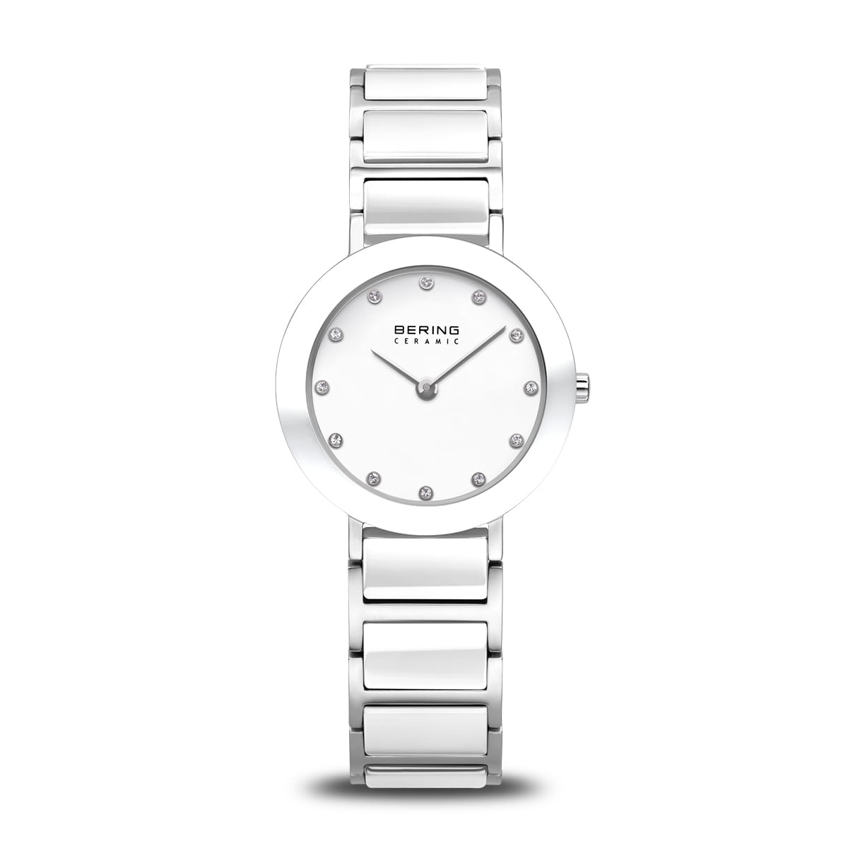 Montre argentée avec un cadran minimaliste et des index en strass, bracelet en acier inoxydable.