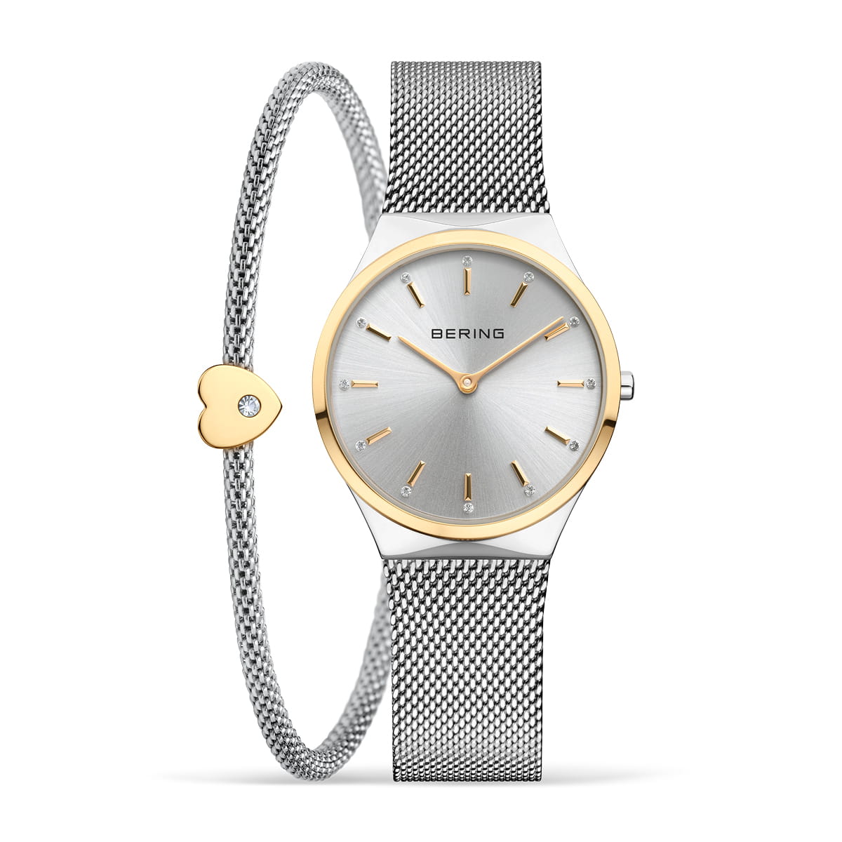 Montre argentée avec cadran doré et bracelet en maille, accompagnée d'un bracelet jonc en métal avec un cœur.