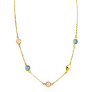 Collier doré avec des pierres colorées rondes en rose et bleu.