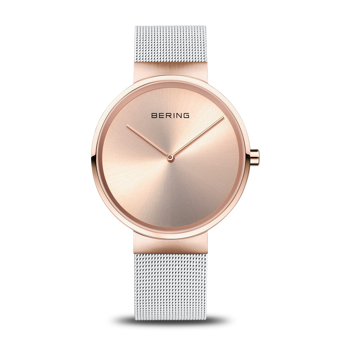Montre Bering avec un cadran rose et un bracelet en maille argentée.