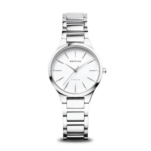 Montre en acier inoxydable avec cadran blanc et bracelet à maillons.