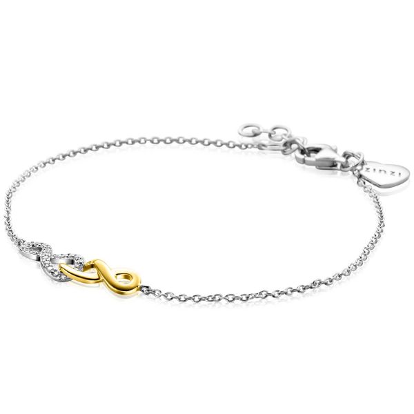 Bracelet en argent avec un symbole infini doré et des détails en zircon.