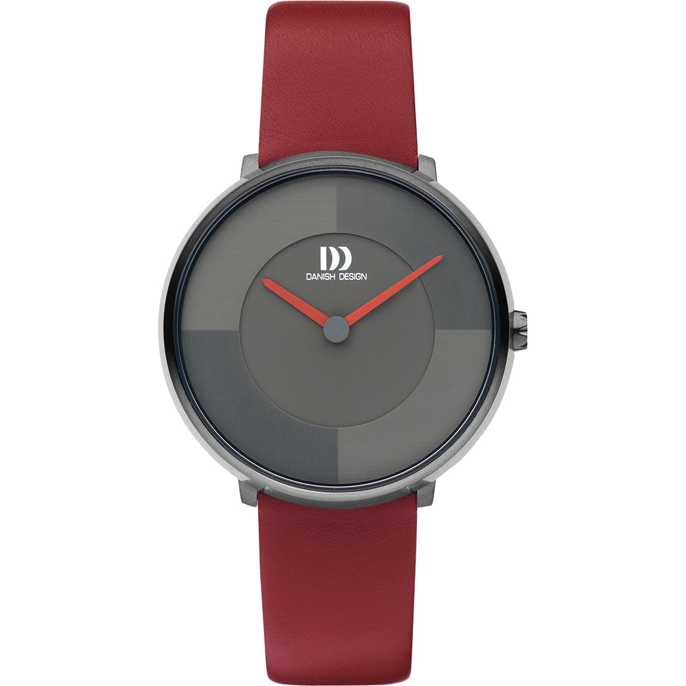 Montre avec un cadran gris, boîtier argenté et bracelet en cuir rouge.