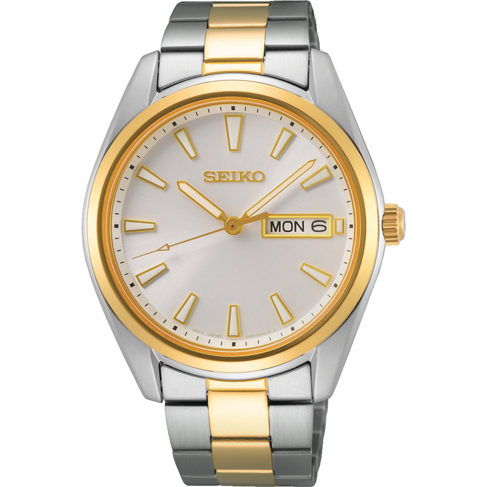 Montre pour homme Seiko avec boîtier argenté et doré, cadran argenté, bracelet en acier inoxydable.