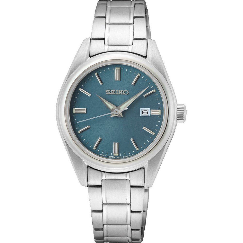 Montre femme Seiko avec boîtier argenté, cadran bleu et bracelet en acier inoxydable.
