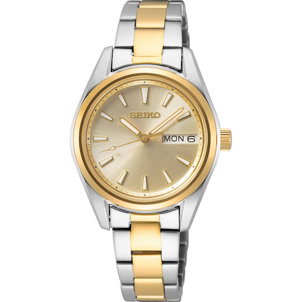 Montre pour femme Seiko avec boîtier argenté et doré, cadran doré et bracelet en acier inoxydable.