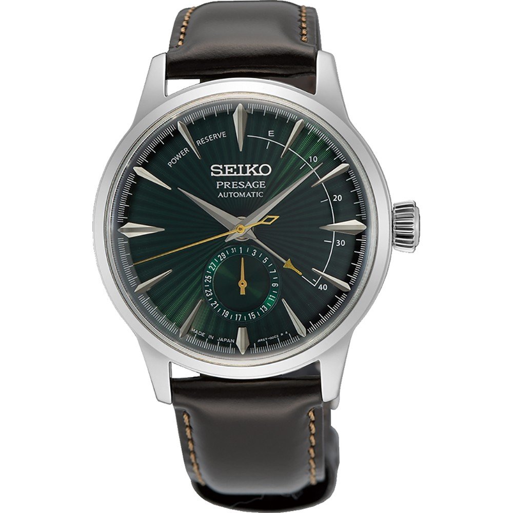 Montre automatique pour homme Seiko avec cadran vert, boîtier en acier inoxydable et bracelet en cuir marron.