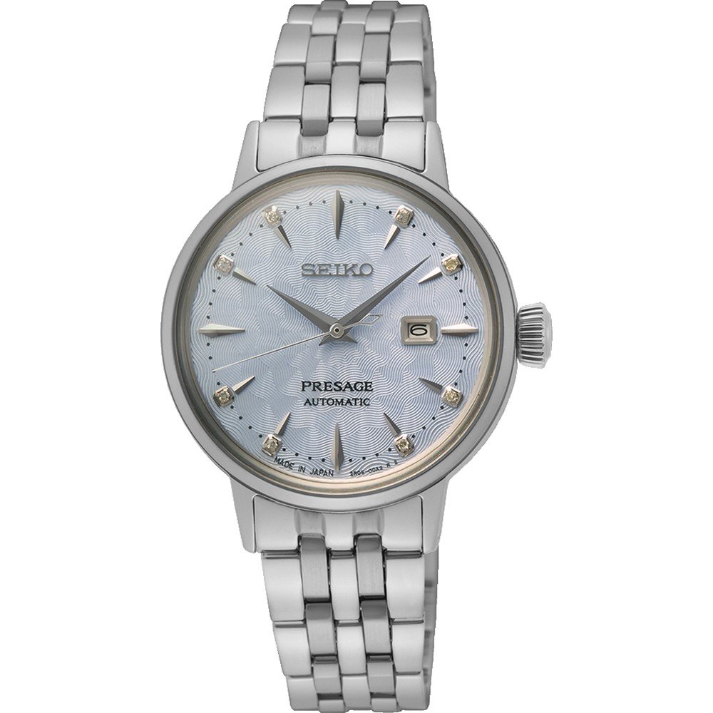 Montre Seiko pour femme avec bracelet en acier inoxydable, cadran argenté et index dorés.