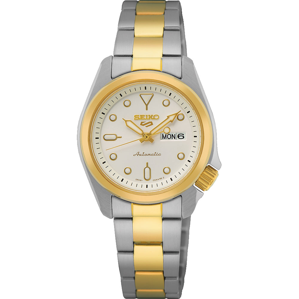 Montre pour femme Seiko avec boîtier argenté et doré, cadran blanc et bracelet en acier inoxydable.