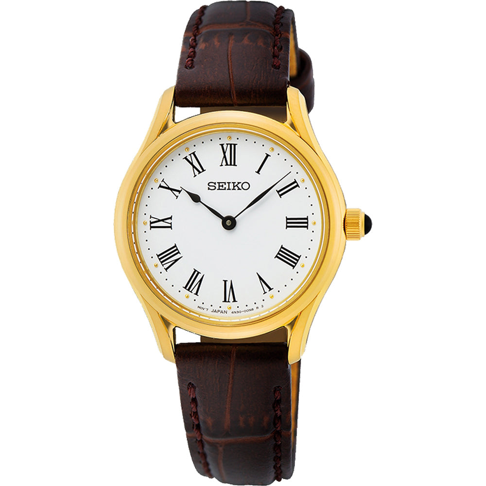 Montre pour femme Seiko avec boîtier doré, cadran blanc et bracelet en cuir marron.