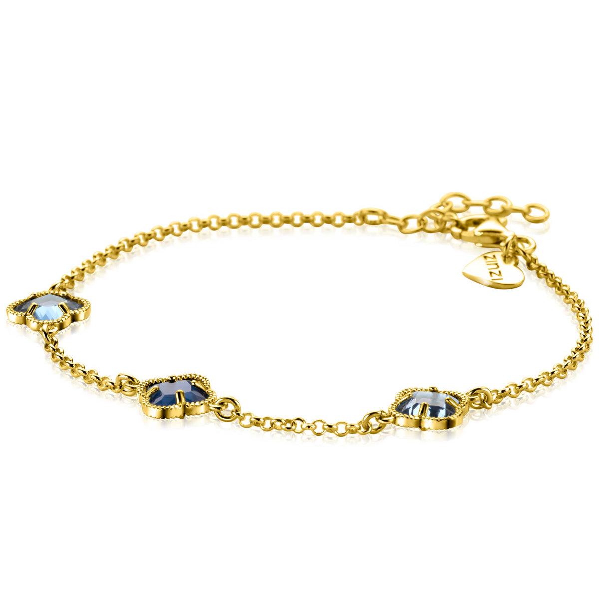 Bracelet en argent avec trois motifs floraux et pierres bleues.
