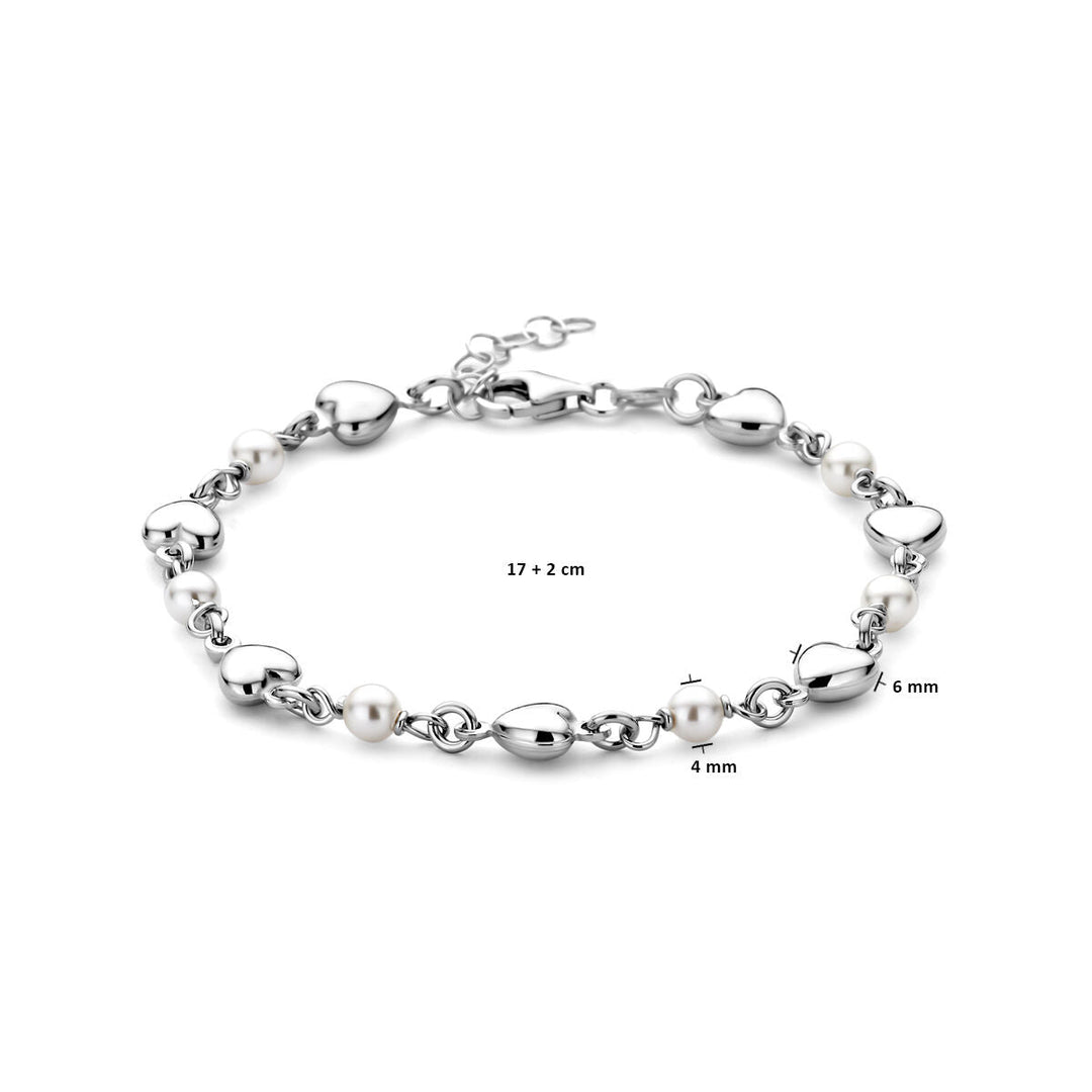 De Zilveren armband dames hartjes en swarovski parels gerhodineerd van Van der Kooij Collectie heeft afwisselende hart- en ronde schakels met witte Swarovski parels, verstelbaar van 17 + 2 cm, met kralen van 4 mm en 6 mm.