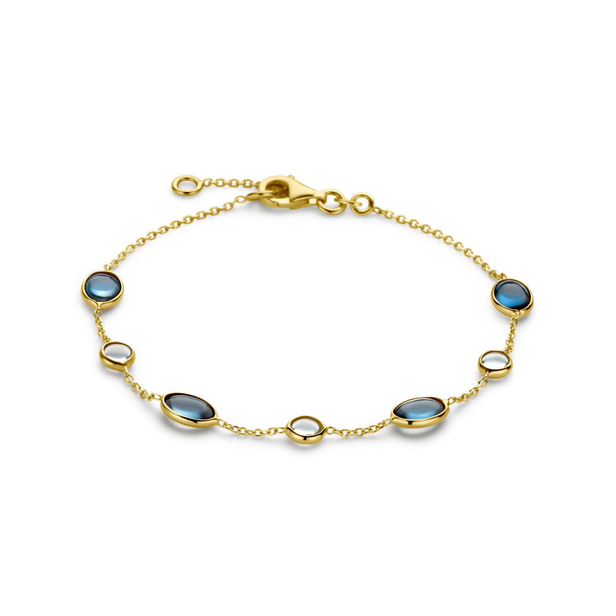 Bracelet en or 14K avec topazes london blue et topazes bleues, ornée de plusieurs pierres ovales.