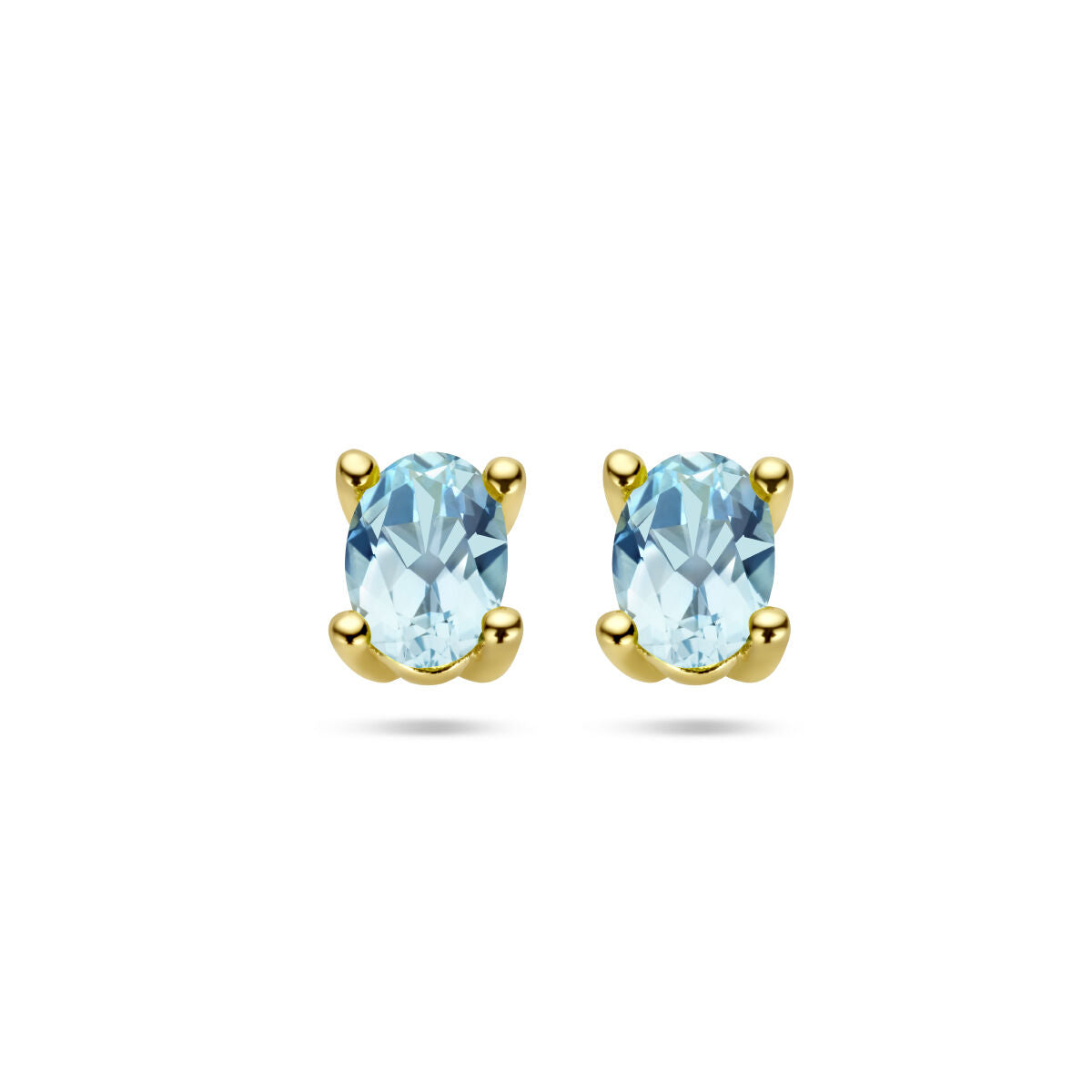 Boucles d'oreilles en topaze bleue avec monture en or jaune 14K.