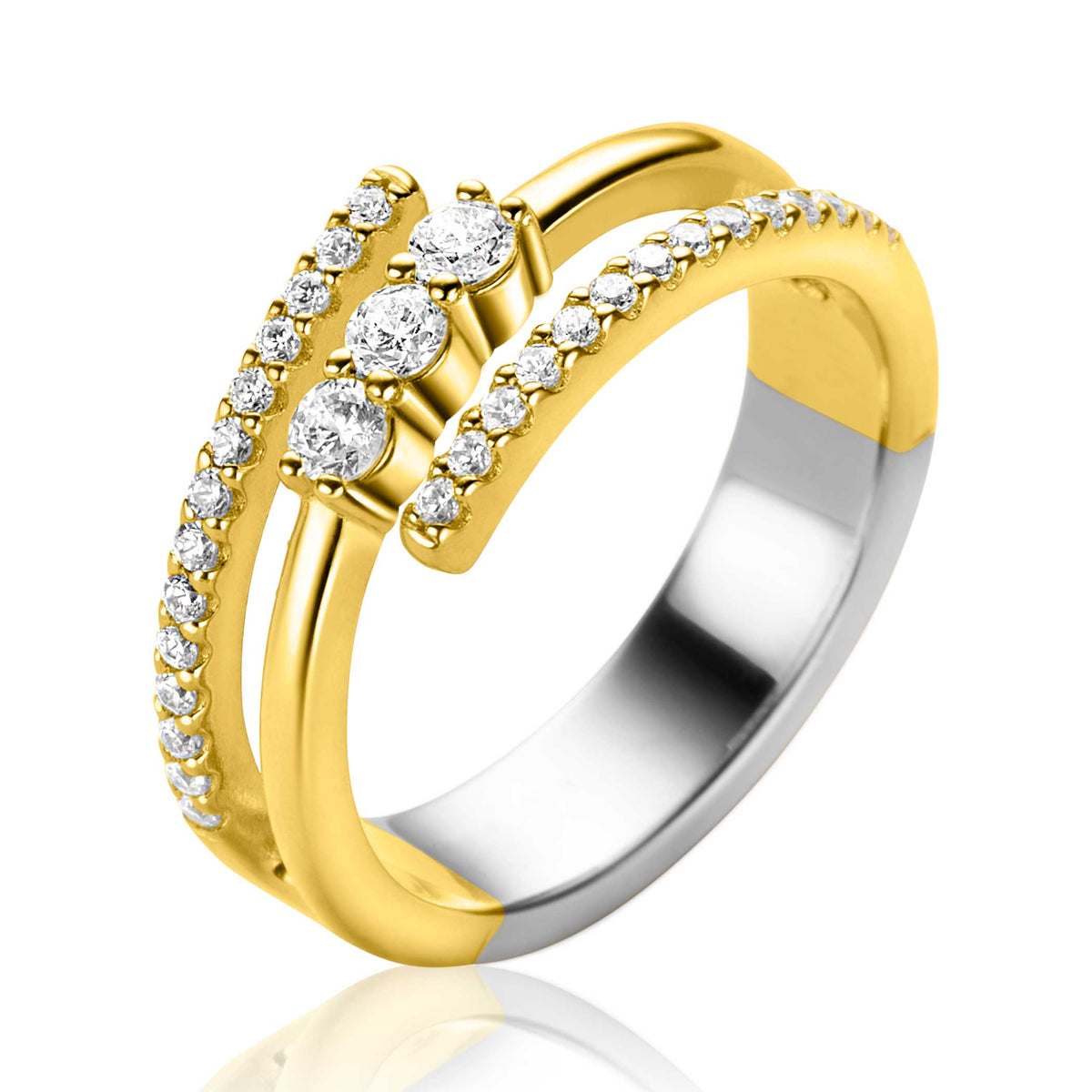 Bague en argent avec des détails dorés, ornée de trois pierres brillantes et de petites zircons.
