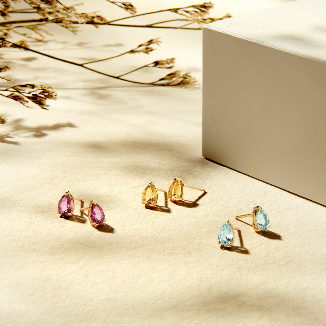 oorknoppen blauw topaas 14K geelgoud