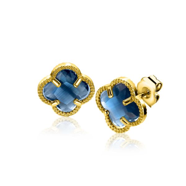 Boucles d'oreilles dorées en forme de fleur avec pierres bleues.