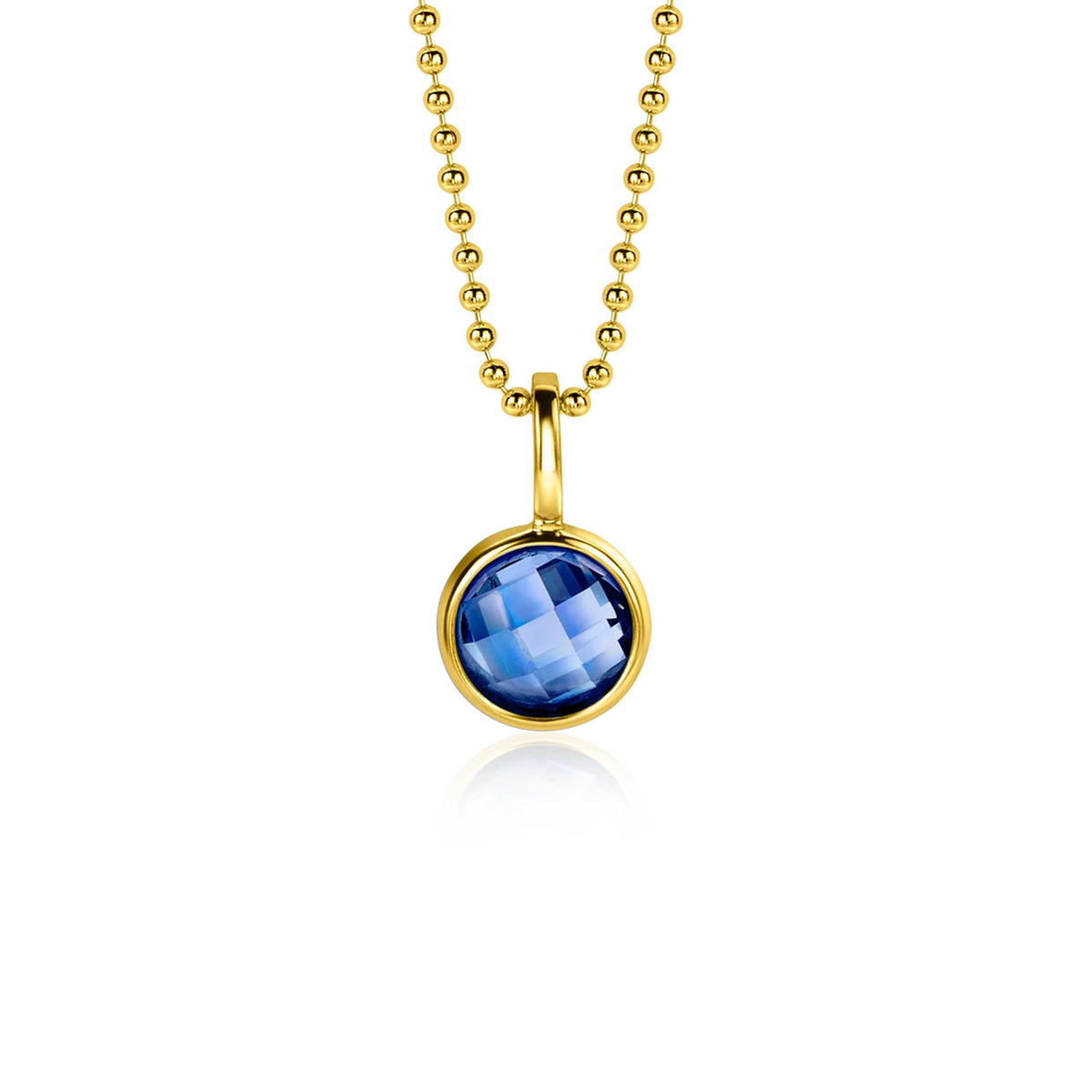 Pendentif doré avec une pierre bleue ronde et facettée, suspendu à une chaîne à billes.