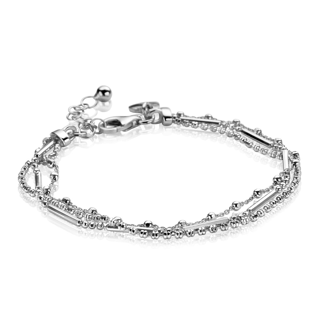 De Zinzi Armband Zilver Zia1462 is een delicate zilveren armband met een dubbele ketting, kleine kraaltjes en een karabijnsluiting, elegant gepresenteerd op een reflecterend wit oppervlak.