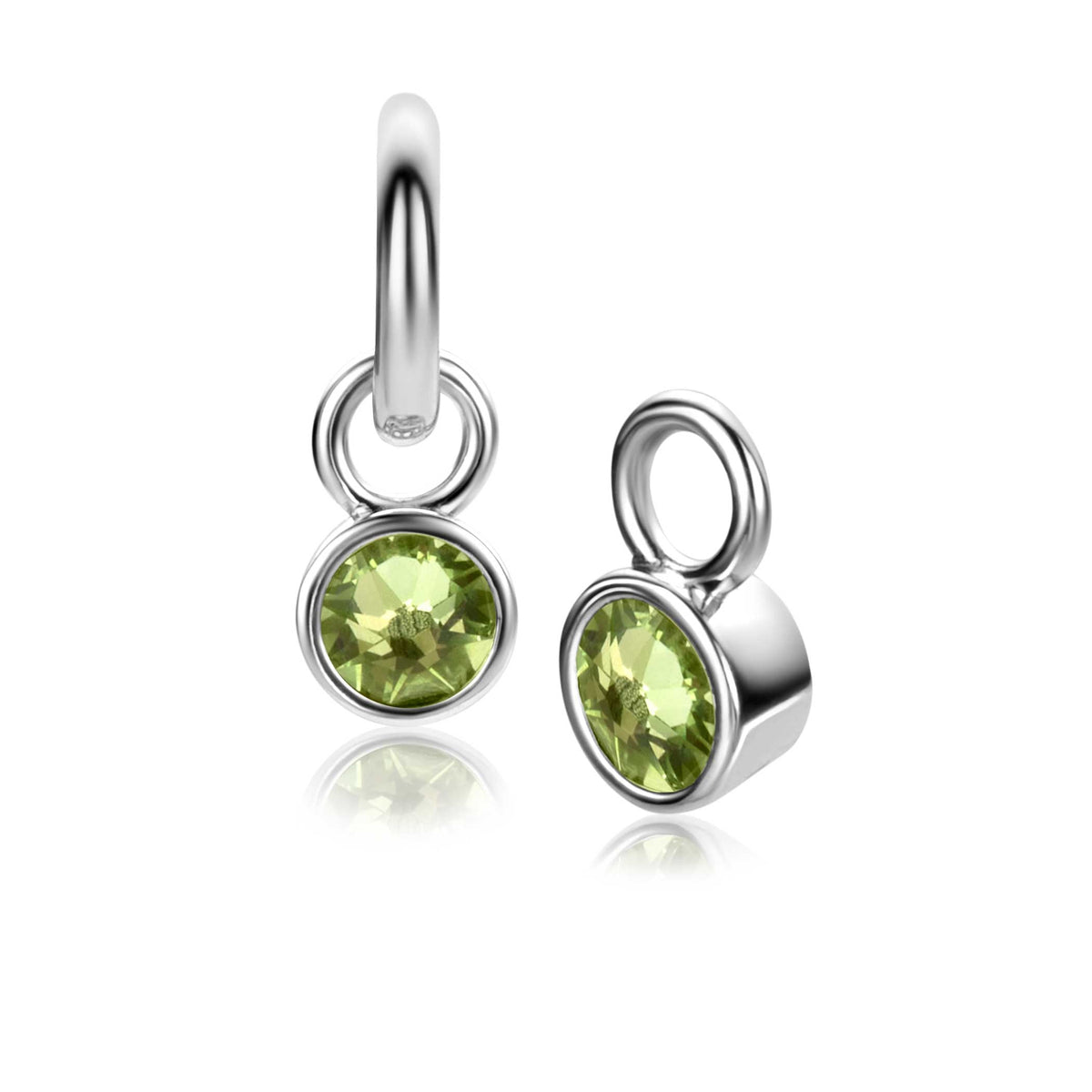 Boucles d'oreilles en argent avec des pierres vertes en forme de rond.