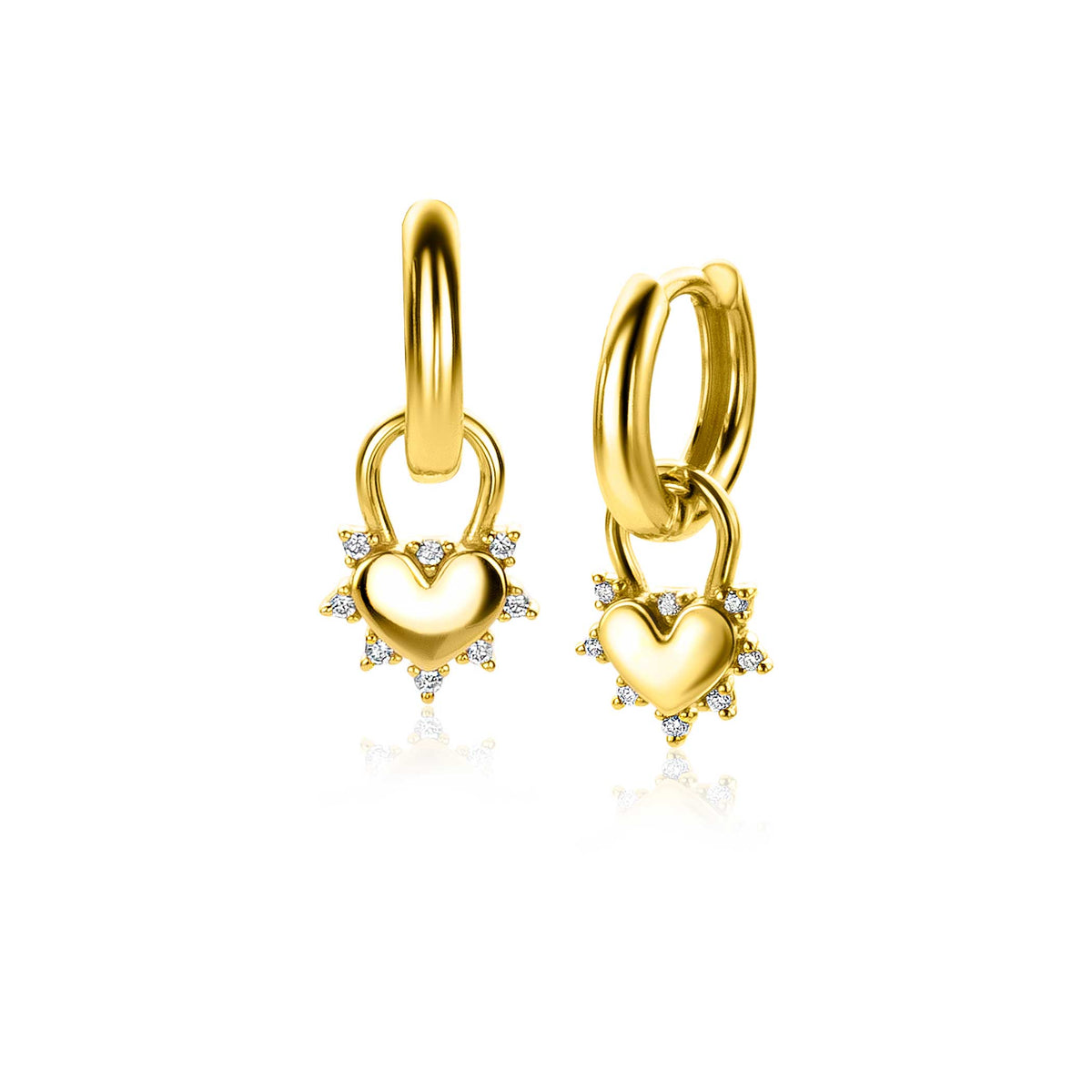 Boucles d'oreilles dorées avec un pendentif en forme de cœur orné de pierres scintillantes.