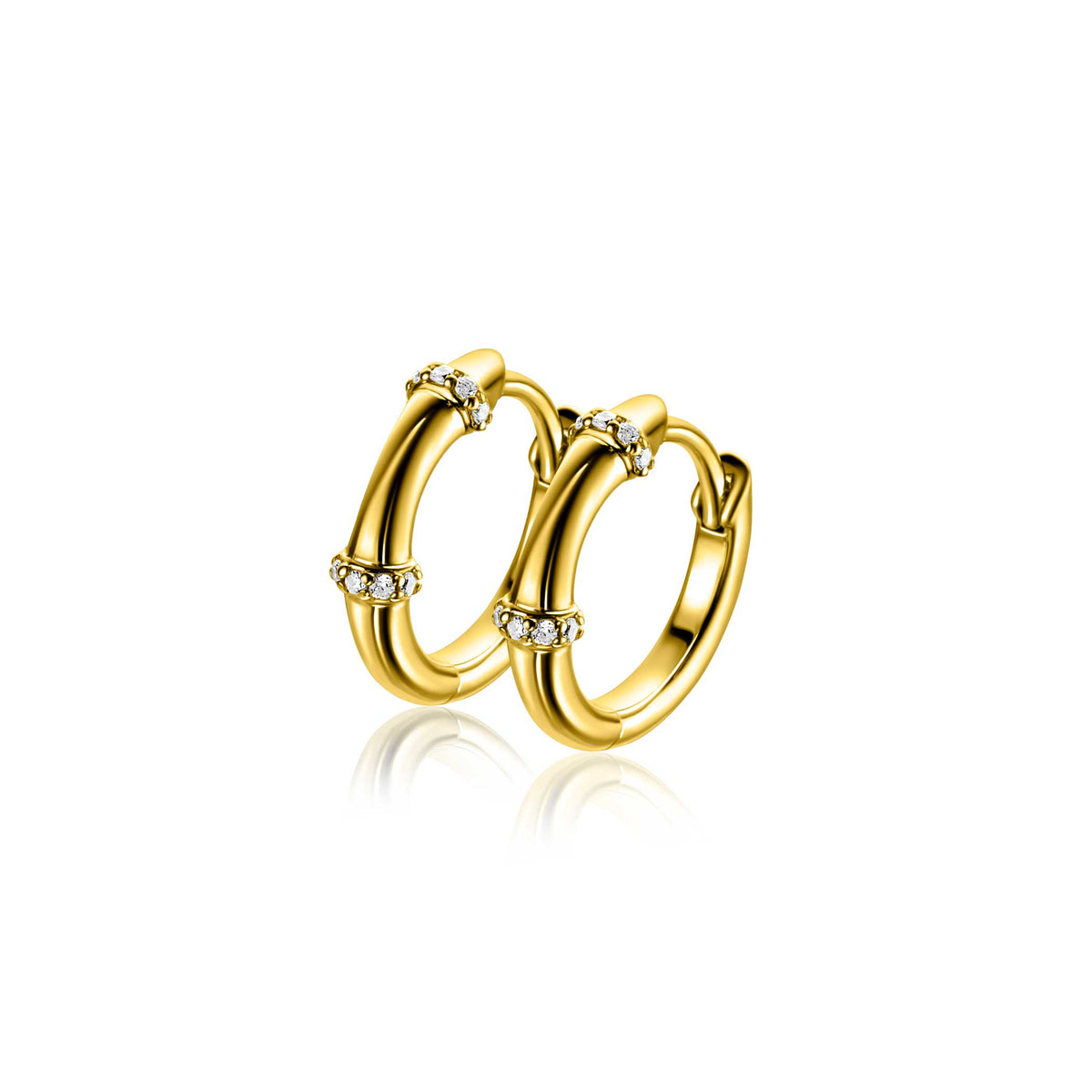 Boucles d'oreilles en argent avec des détails dorés et des pierres scintillantes.