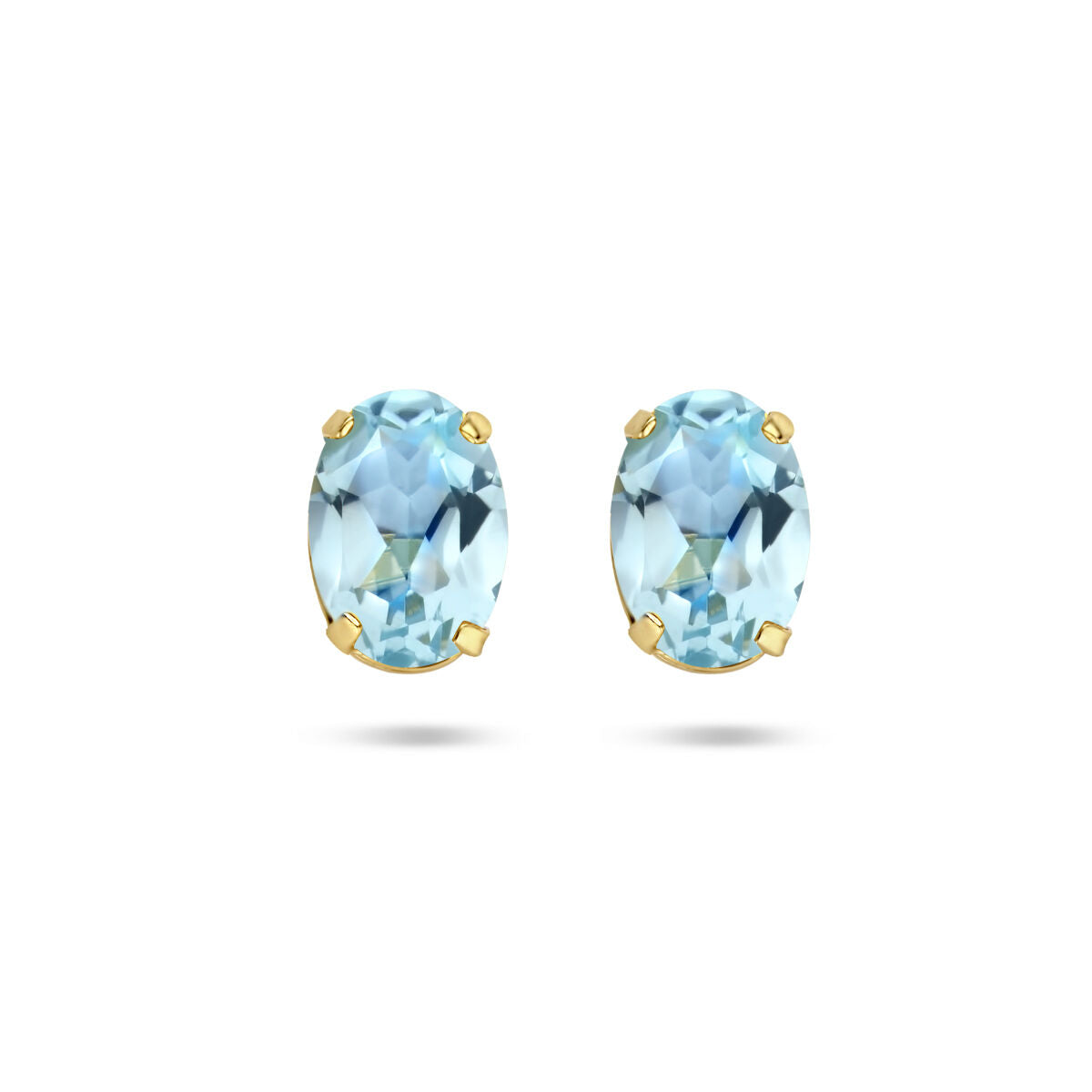 Boucles d'oreilles en topaze bleue, serties en or jaune 14K, avec une forme ovale.