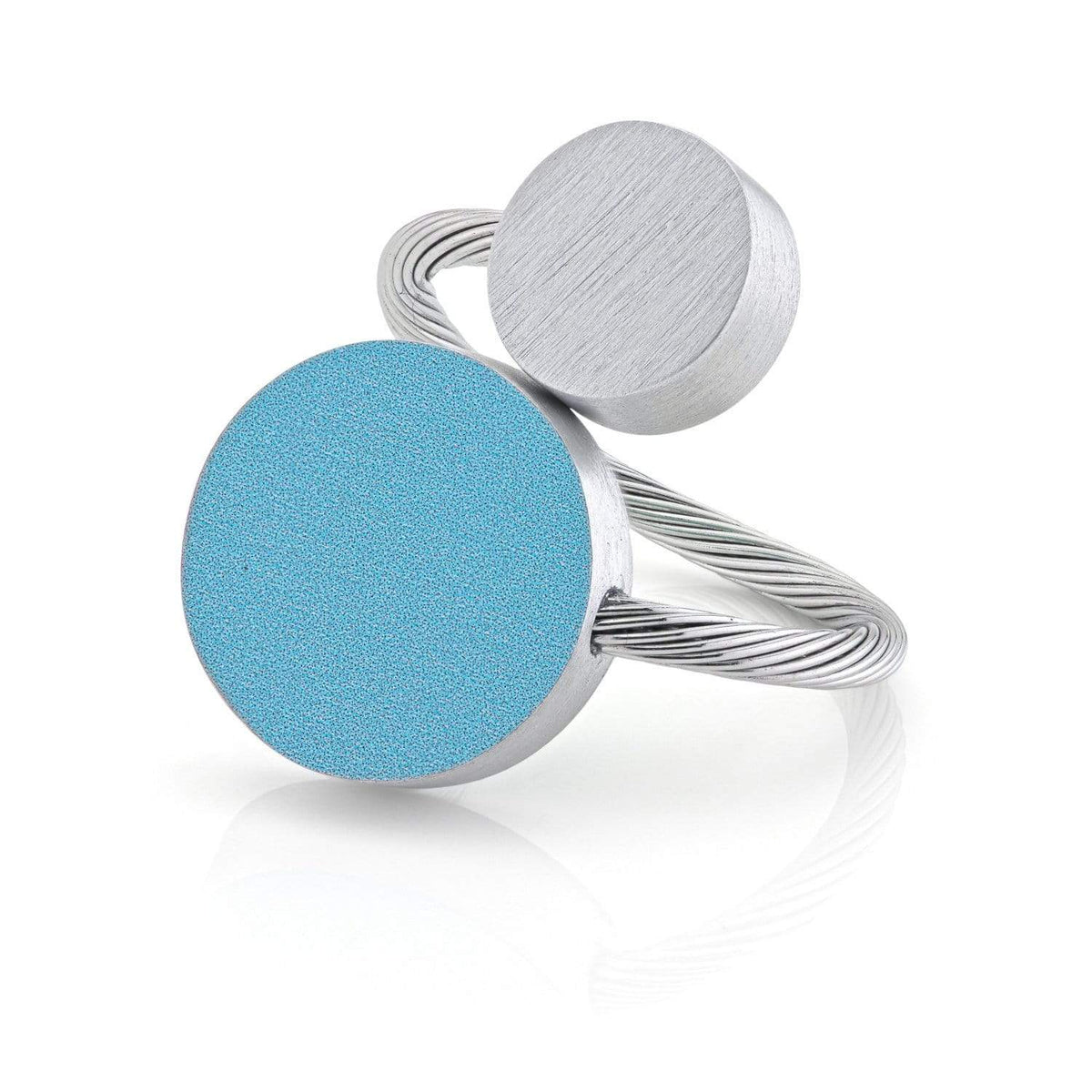 Bague en argent avec deux formes rondes, l'une bleue et l'autre en métal brossé.