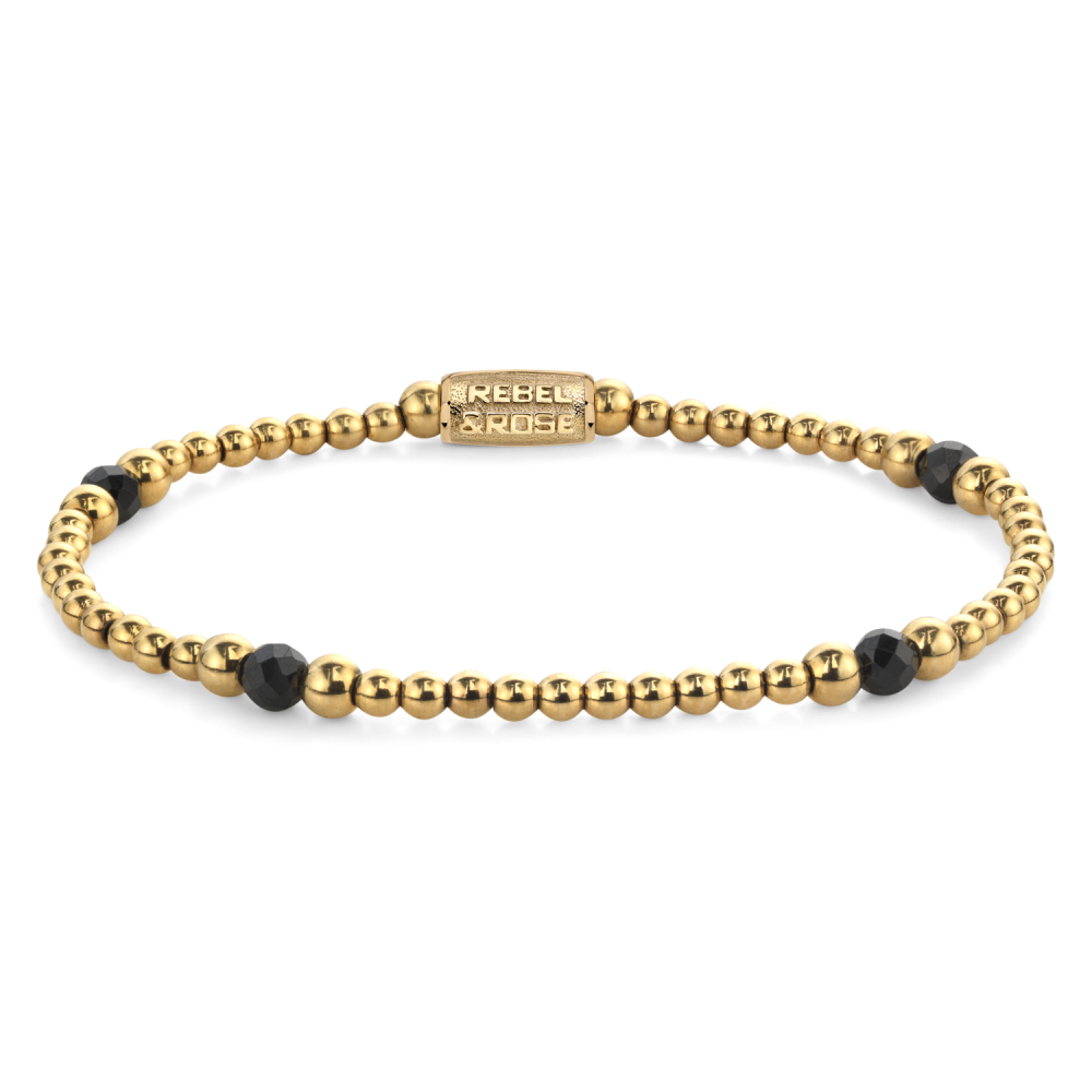 Bracelet doré avec des perles noires et dorées, design élégant et moderne.