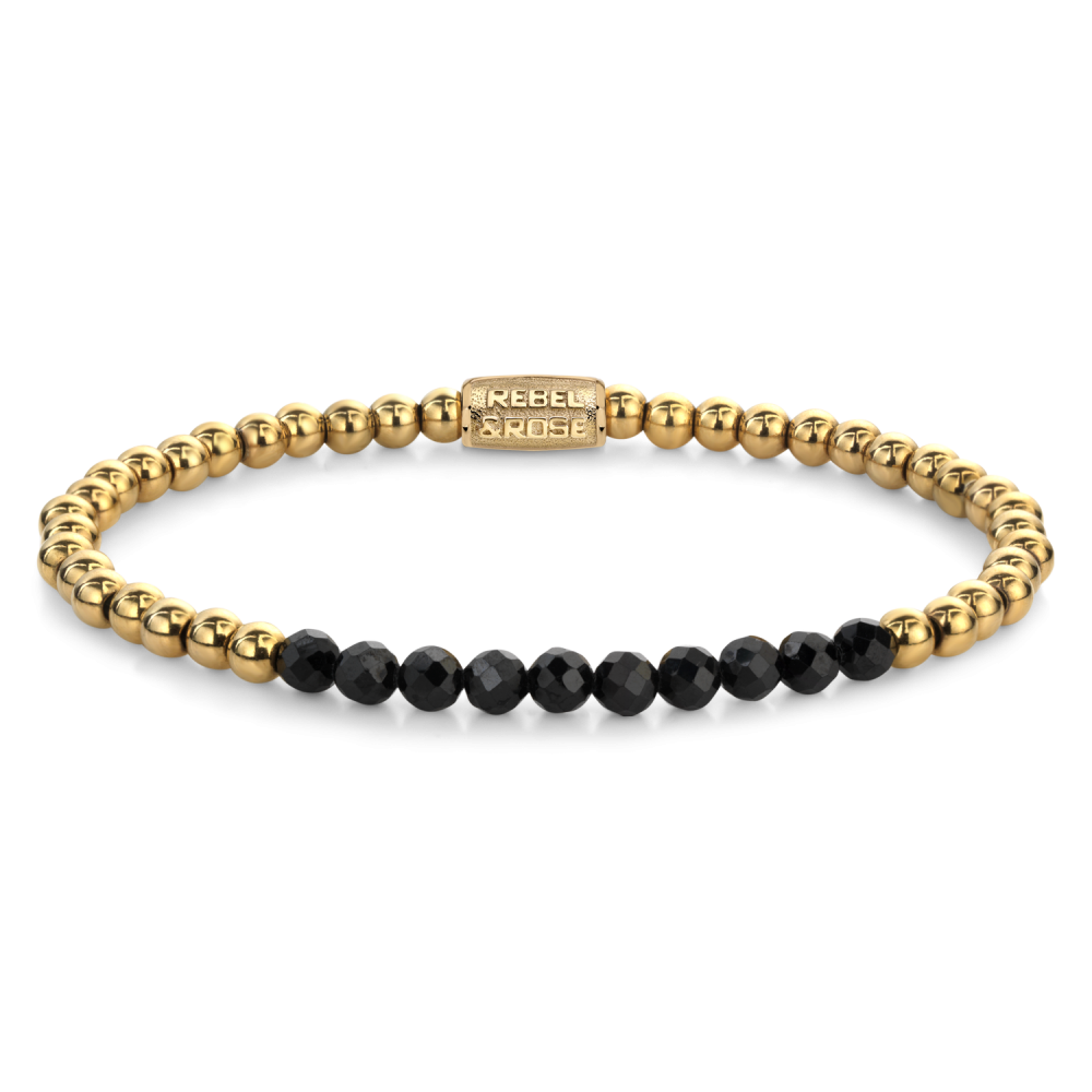 Bracelet en perles dorées avec des perles noires brillantes au centre.