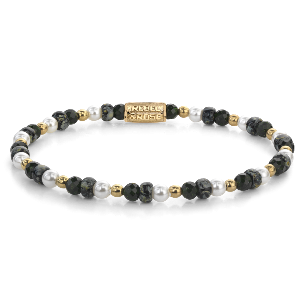 Bracelet en perles noires et blanches avec des accents dorés.