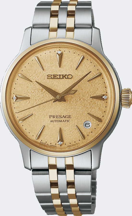 Montre automatique Seiko Presage avec boîtier argenté et doré, cadran doré et bracelet en acier inoxydable.