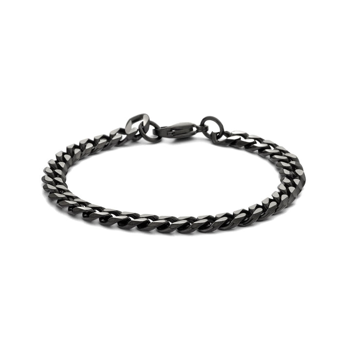 De Van der Kooij Collectie Gourmette 7,0 mm edelstaal armband met ion plating heeft strakke in elkaar grijpende schakels en een sluiting, afgebeeld tegen een witte achtergrond.