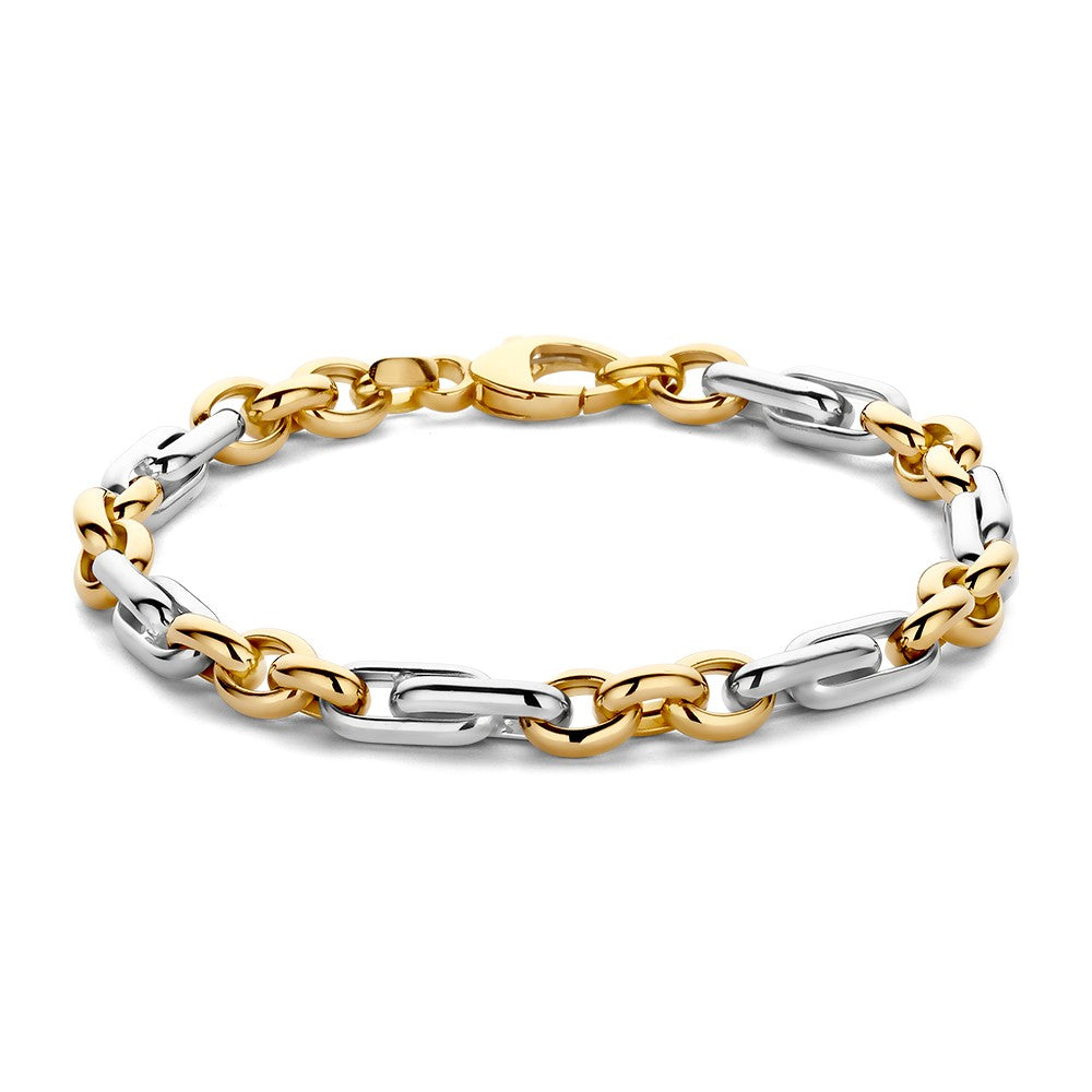 Bracelet bicolore en maillons argentés et dorés avec fermoir.