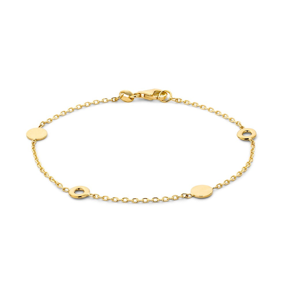 Bracelet en or jaune avec des disques ronds espacés.