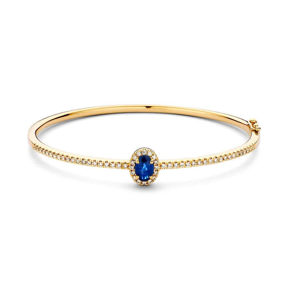 Bracelet jonc en or avec un saphir central et des diamants autour, finition brillante.