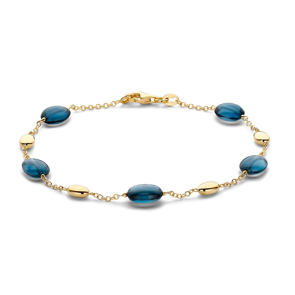 Bracelet en or jaune avec topazes bleues, 19 cm, 7 mm de large.