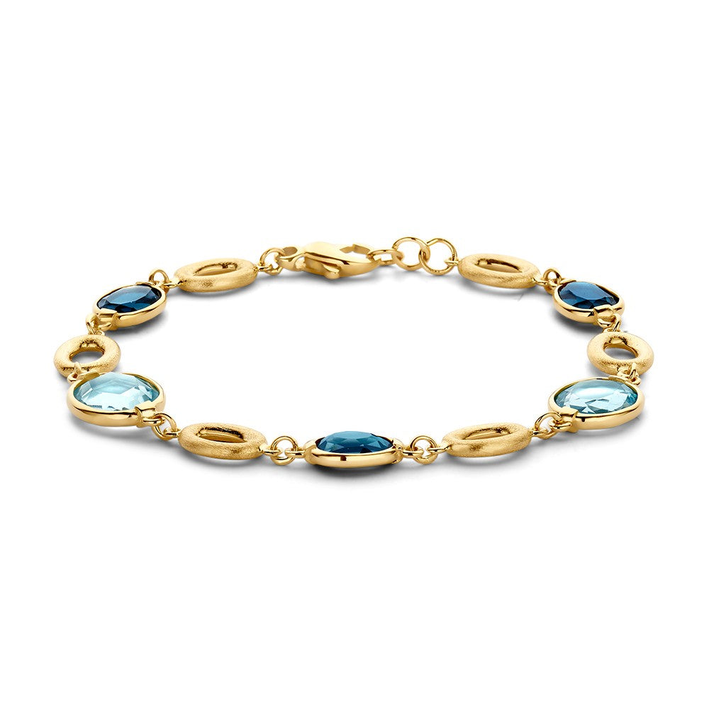 Bracelet en or jaune avec des pierres précieuses bleues et vertes.