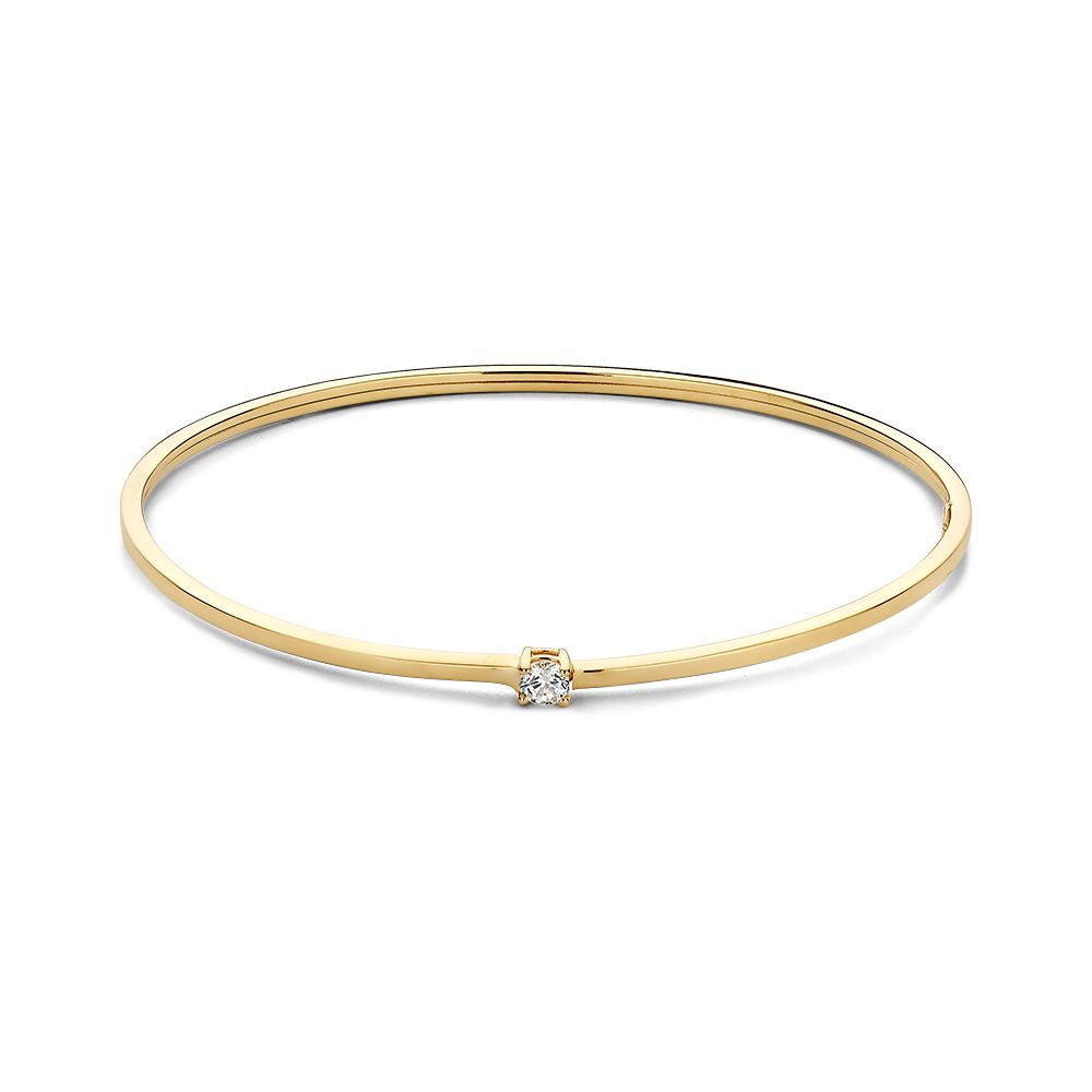 Bracelet jonc en or jaune de 14 carats avec un zircon.