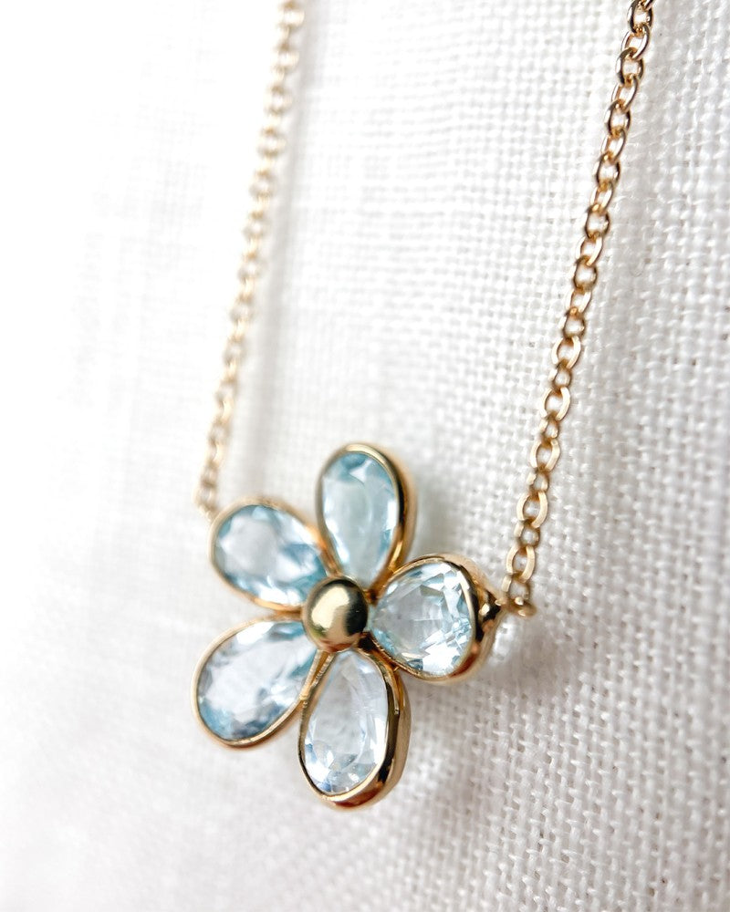 Collier en or jaune avec pendentif floral ludique et topaze bleue – or 14 carats