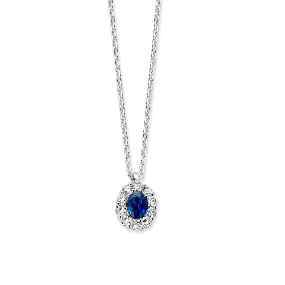 Collier en or blanc avec un saphir bleu entouré de diamants, chaîne délicate.