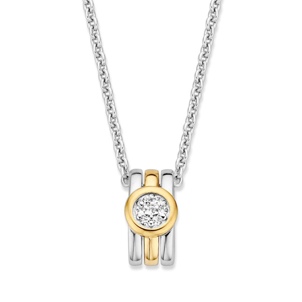Pendentif argenté avec détails dorés et zirconia blanche, diamètre de 14 mm.