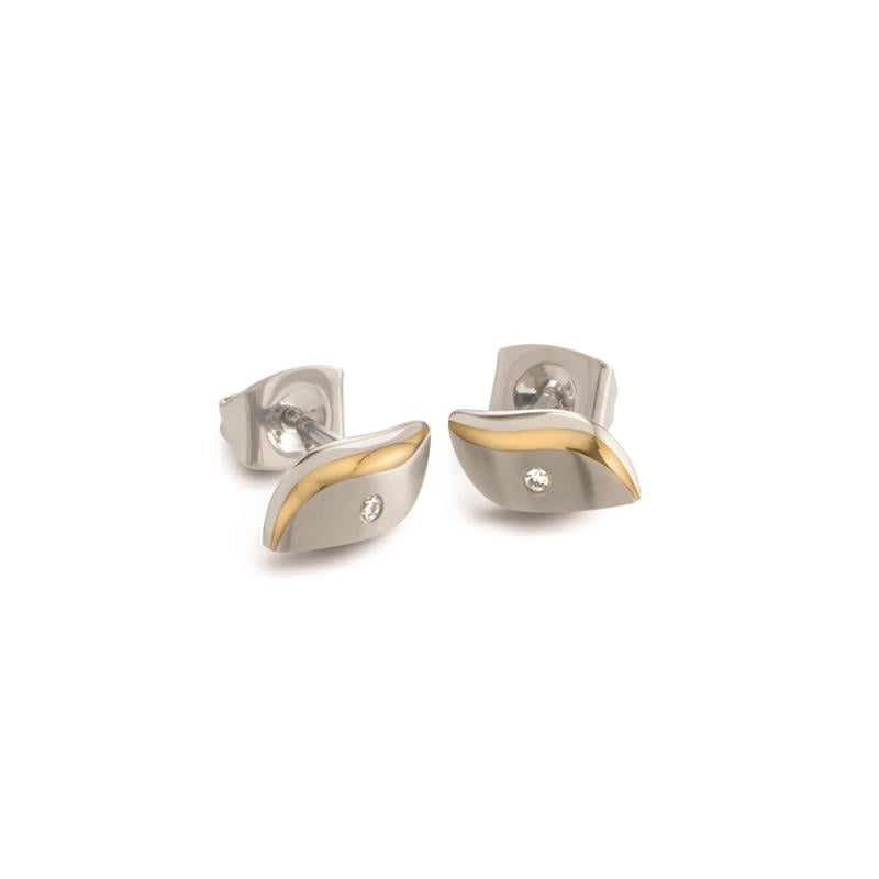 Boucles d'oreilles en titane bicolores avec un design ondulé et un petit diamant.