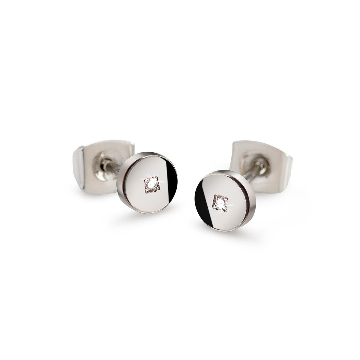 Boucles d'oreilles en titane avec un design rond et un petit diamant au centre.
