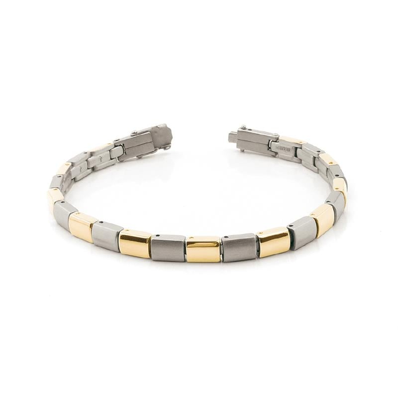 Bracelet bicolore en titane avec des maillons argentés et dorés.
