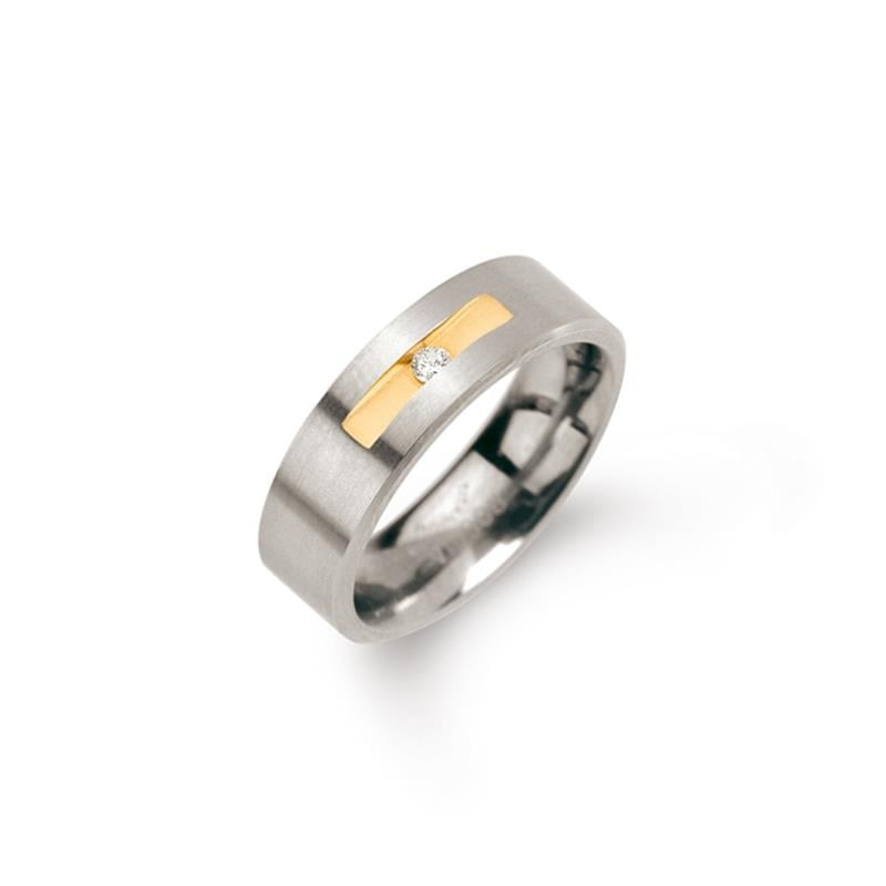 Bague en titane bicolore avec un diamant central de 0,03 carat.