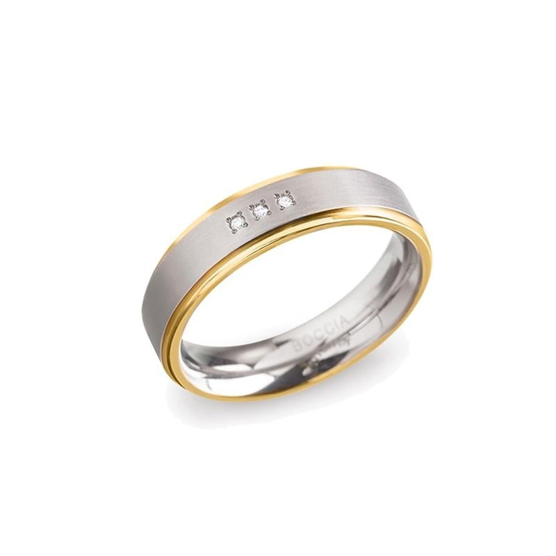 Bague en titane bicolore avec deux petits diamants, finition polie et mate.