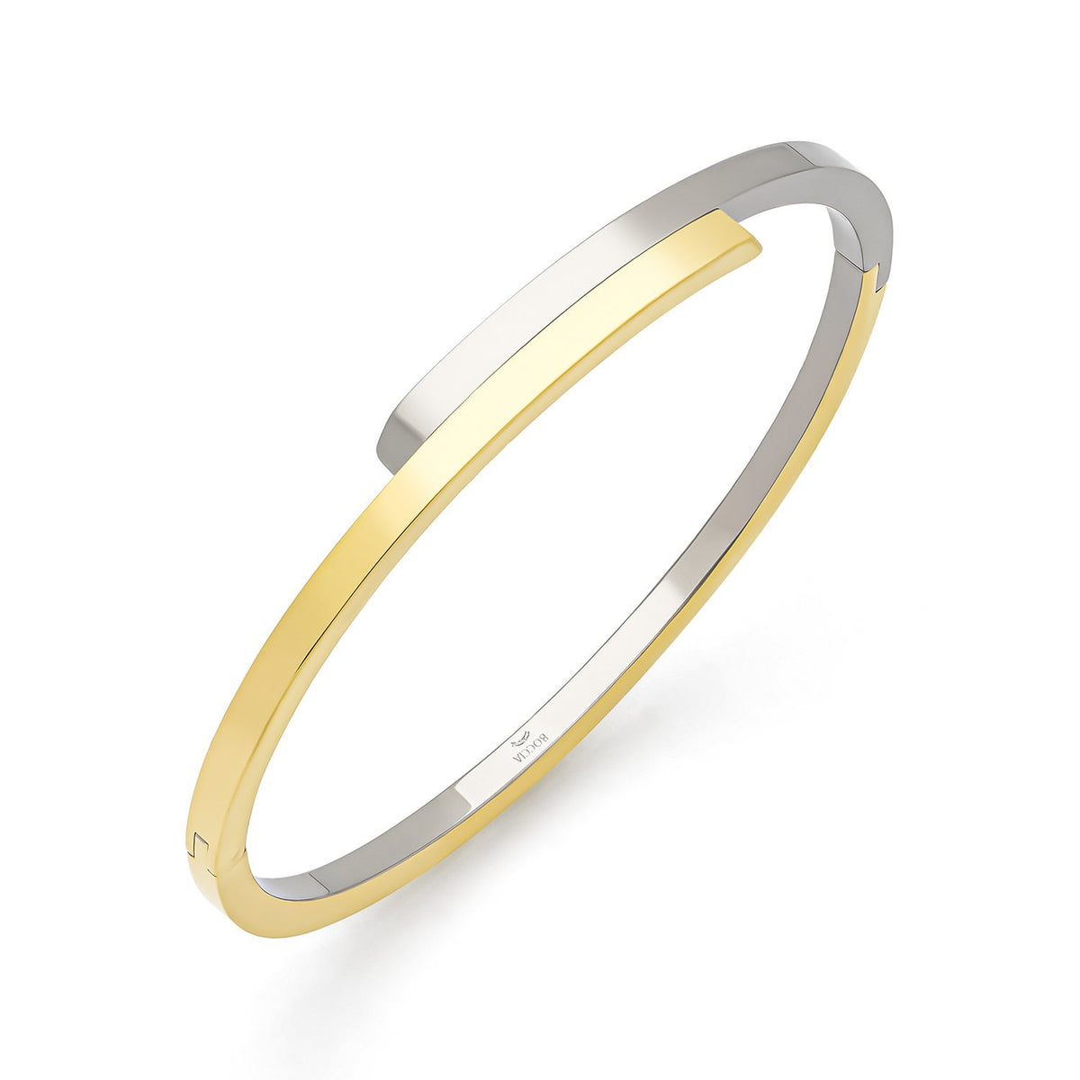 Bracelet jonc en titane bicolore avec une finition argentée et dorée.