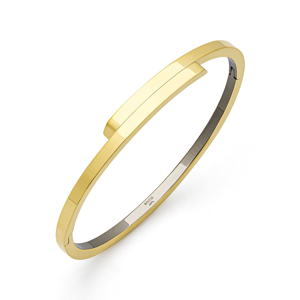Bracelet jonc en titane doré avec une finition lisse et un design minimaliste.